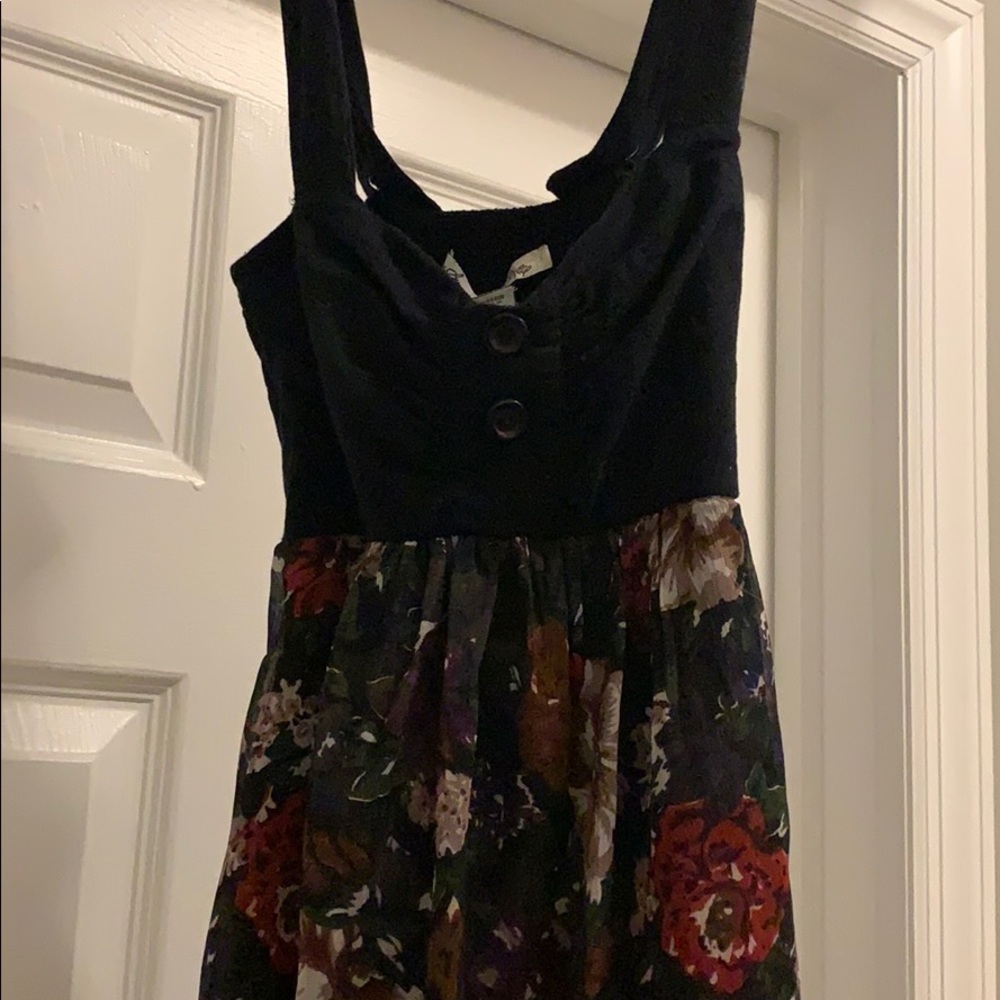 a dress with flowers on bottom